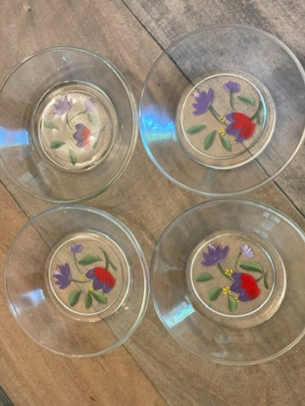 Vintage small clear glass dessert plates with hand painted floral designs. 4"dia
